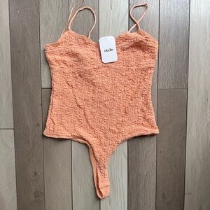 Elodie Orange Bodysuit One Piece with Textured Fabric